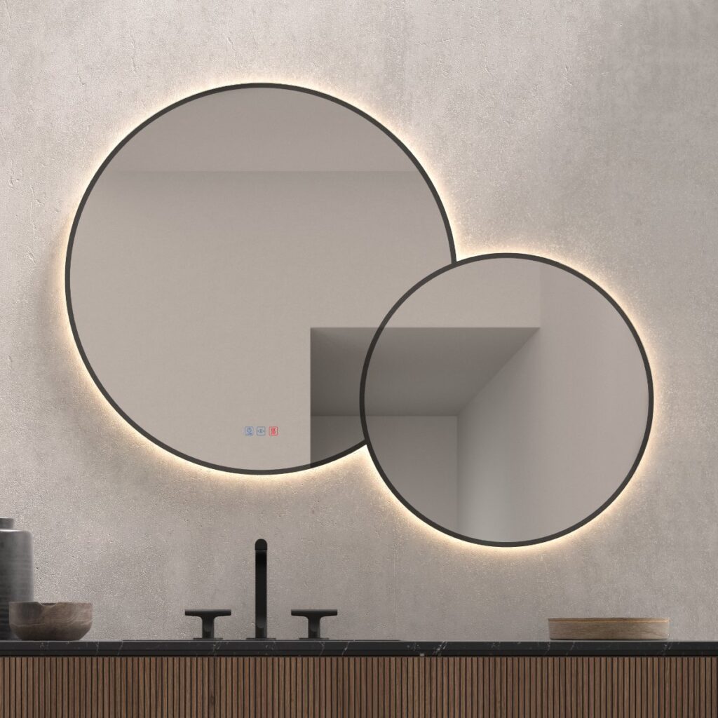 Dos espejos LED redondos en un baño